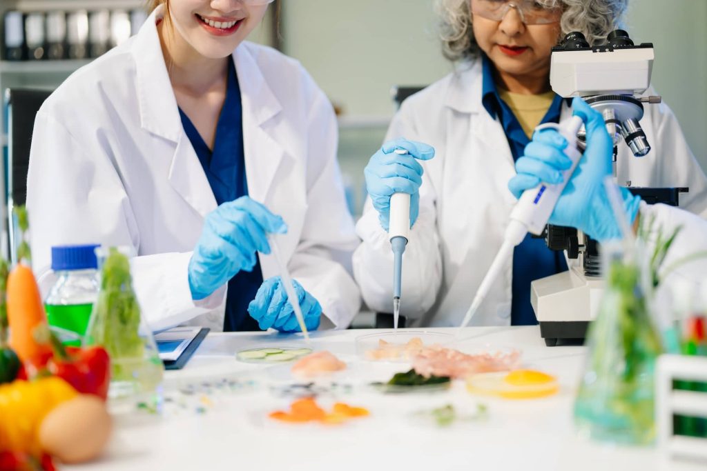food-scientists-in-lab-coats-testing-samples-and-2026-01-09-11-00-49-utc